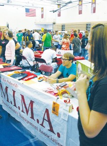 p7-bulldog-bonanza <span class='credit'>Torch File Photo</span><span class='description'>Students checking out RSOs at last year’s Bulldog Bonanza. Pictured here is Matt Bullock, 08-09 President of the Music Industry Management Association manning the booth and providing information for interested students.</span>